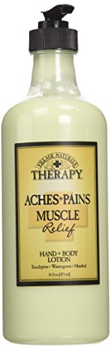 Village Naturals Therapy Muscle Shea Butter Lotion in a cozy bath setting