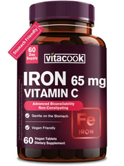 Vitacook iron supplement bottle on kitchen counter with 65 mg iron and vitamin C.