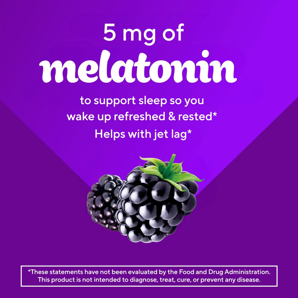 Pour-shot of Vitafusion melatonin gummies spilling from the bottle