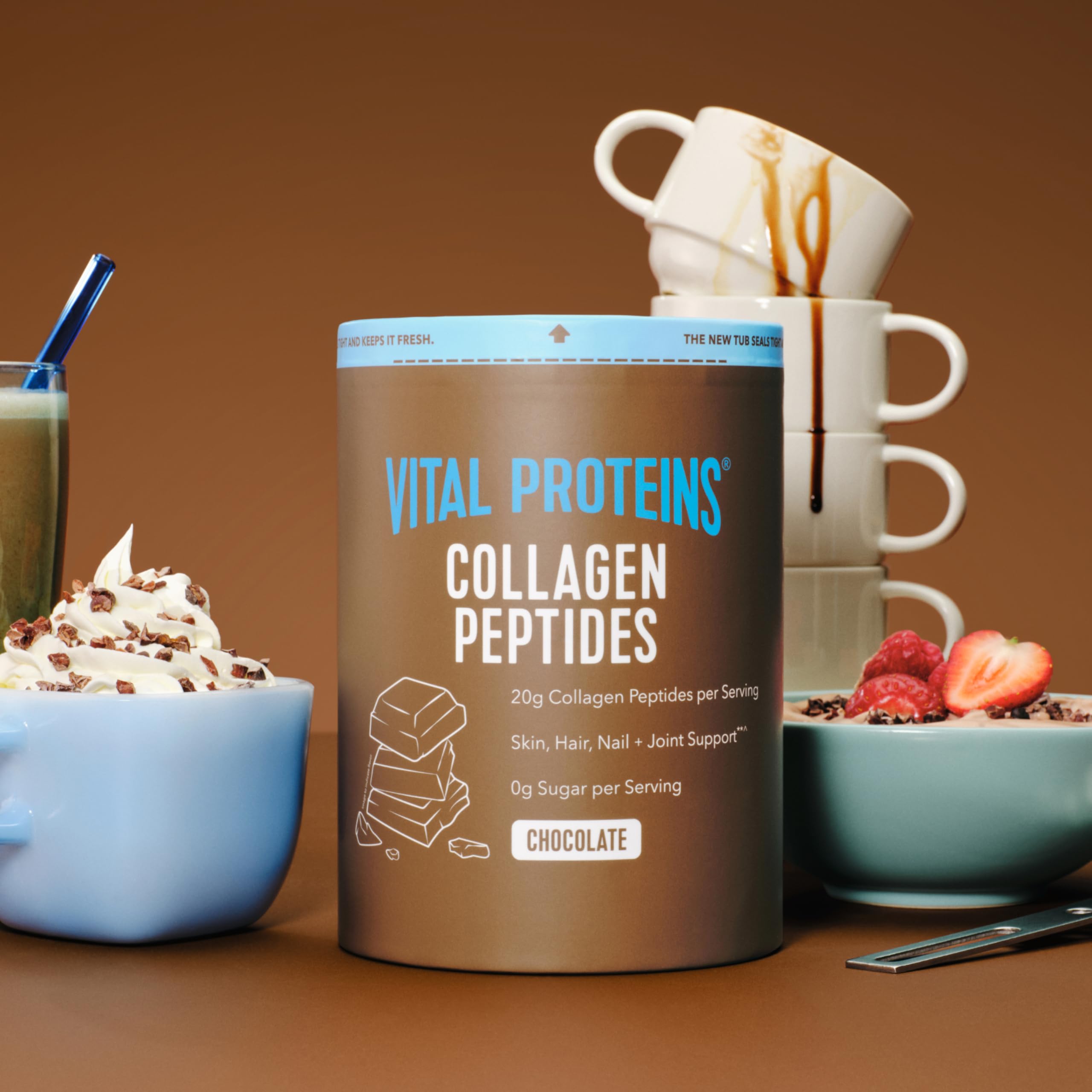 Vital Proteins collagen powder in glass with shake to showcase easy mixing.