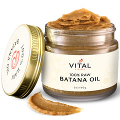 Vital Strands Batana oil bottle pouring to moisturize and boost hair vitality.