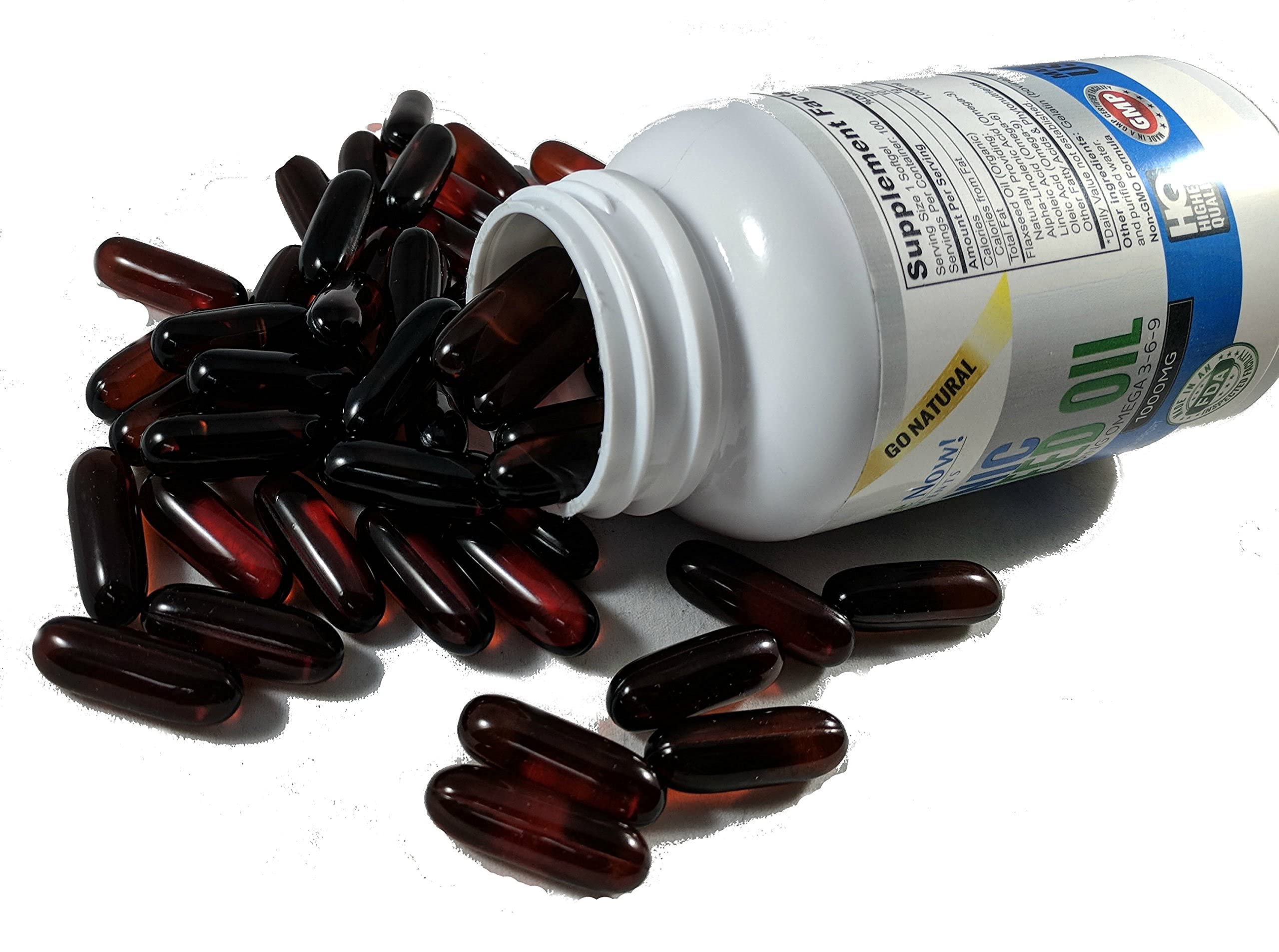 Vitalité Now Upsize capsules resting on a desk for hair, skin, nails support.