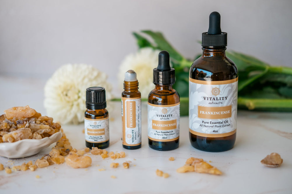 Vitality Frankincense Essential Oil on natural wood background evokes spa vibe.