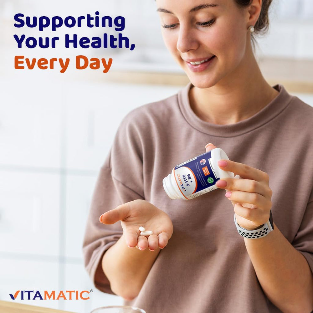 Vitamatic 5-HTP bottle beside a glass for daily use.