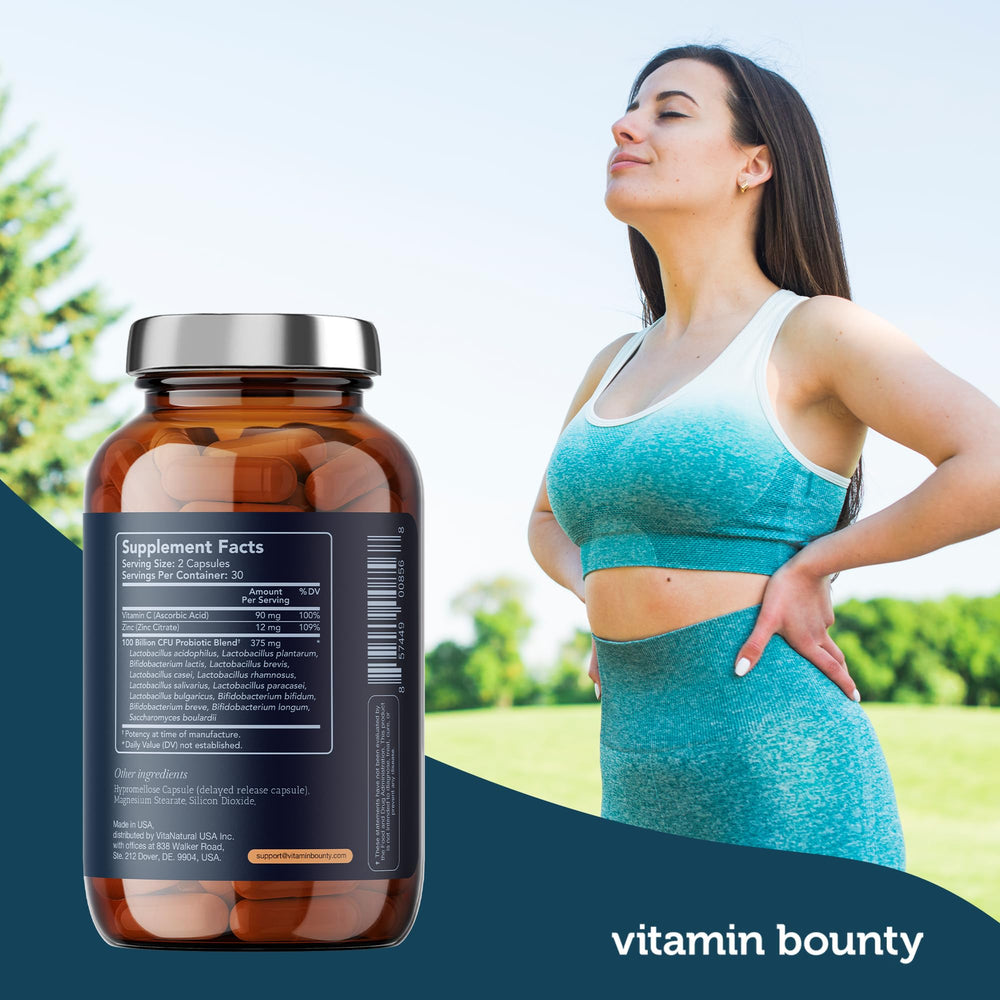 Person holding Vitamin Bounty Pro-100 bottle for daily use by adults