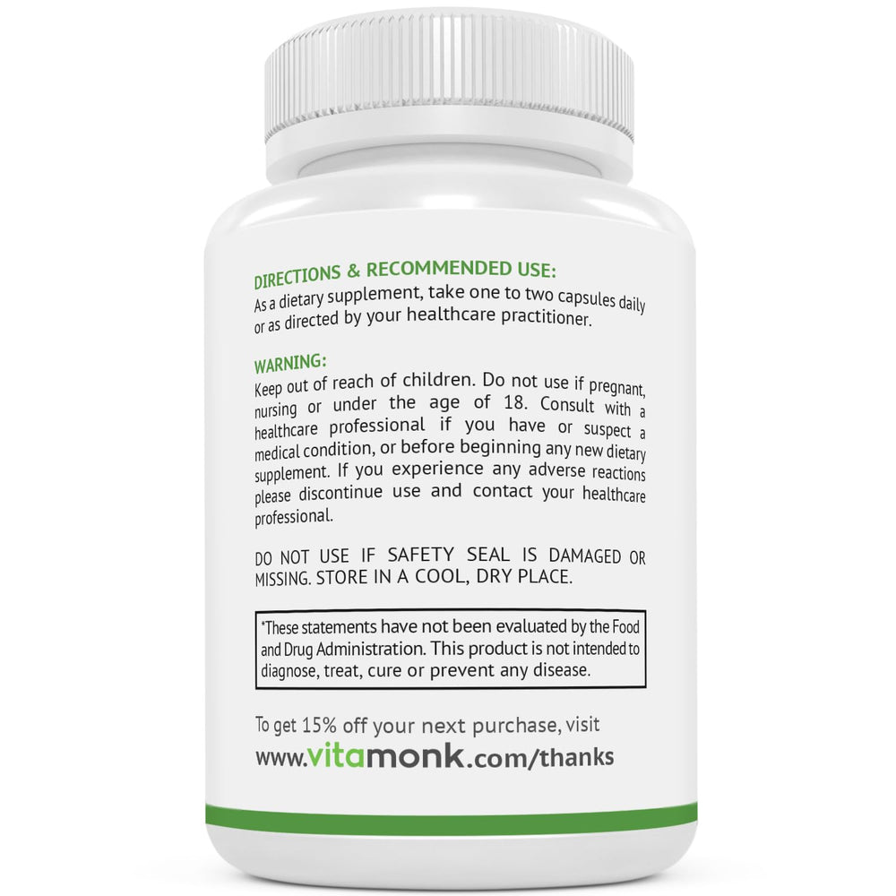 Twist-open VitaMonk bottle showing capsule texture and color.