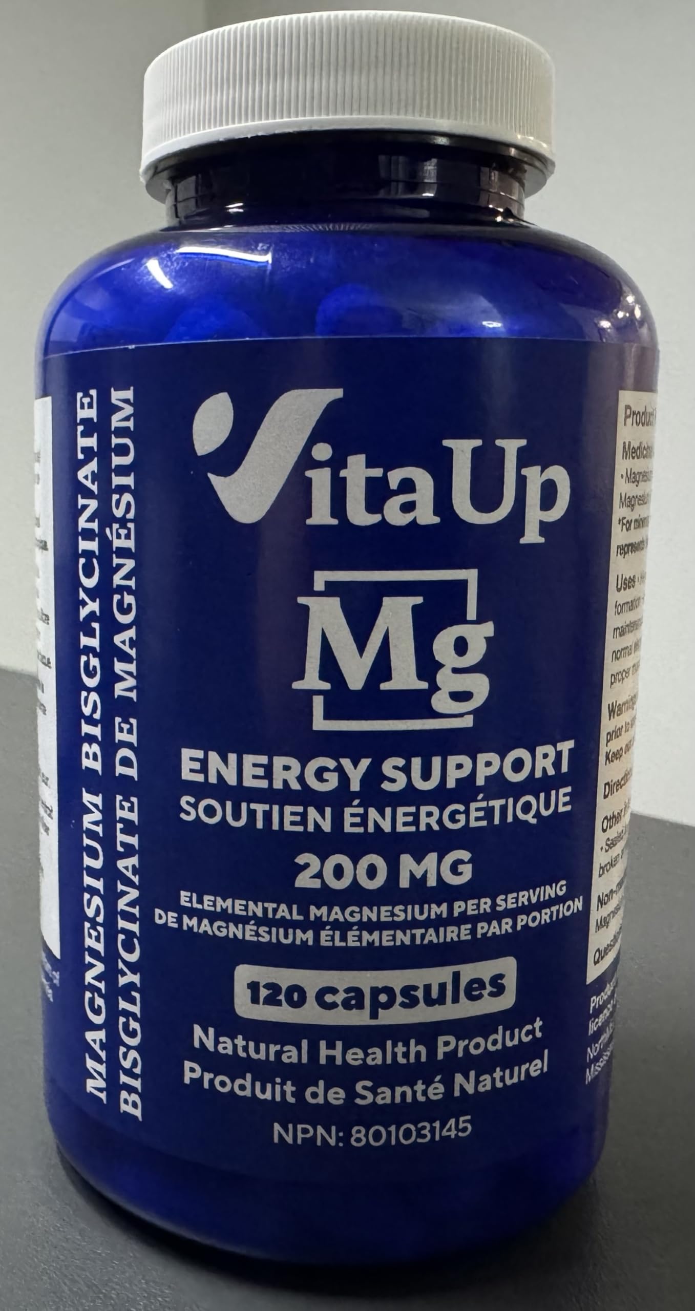 VitaUp Magnesium Glycinate 200mg capsules closeup, vegan chelated capsules for smooth absorption.