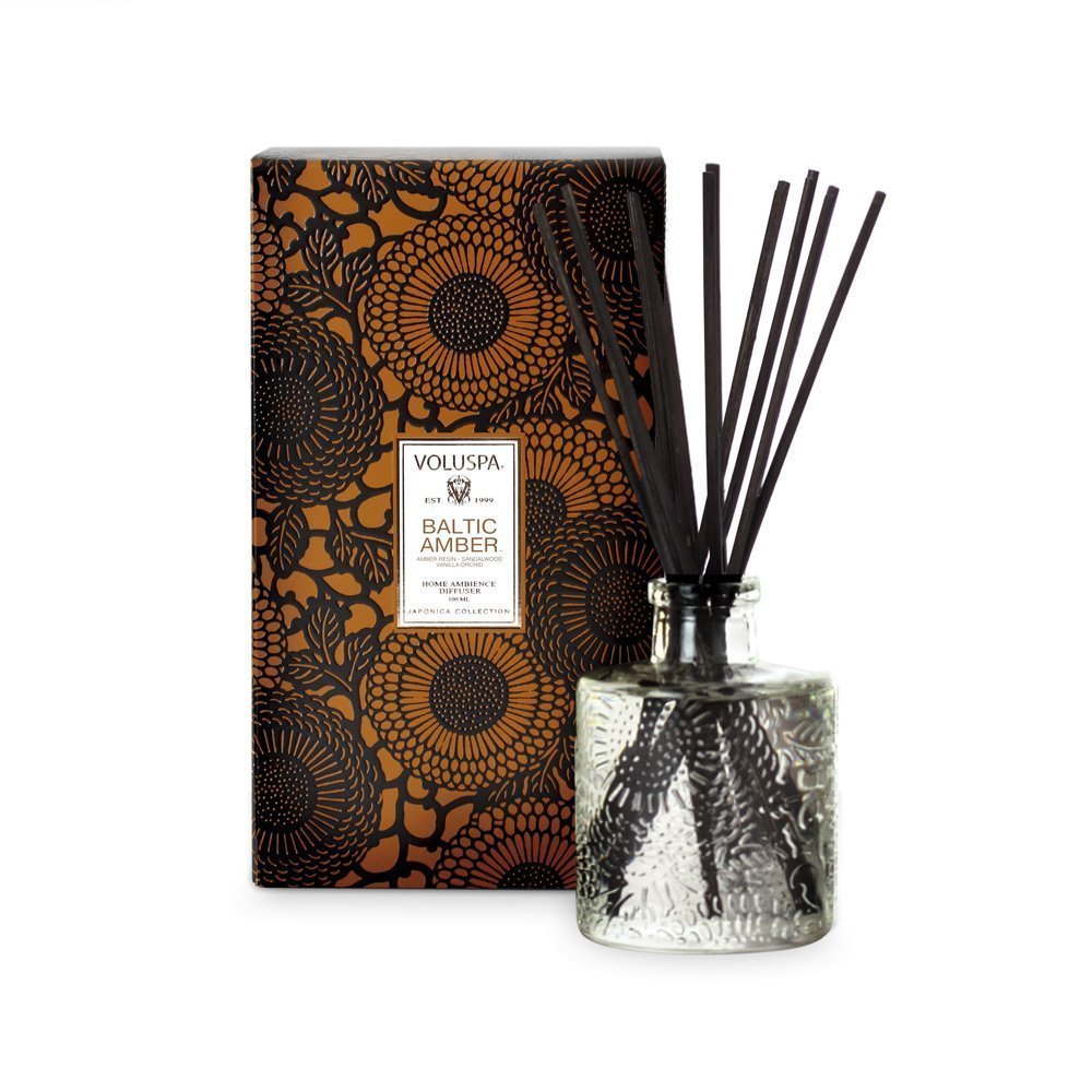 Voluspa Baltic Amber mini diffuser in an embossed glass jar for warm, long-lasting home fragrance.