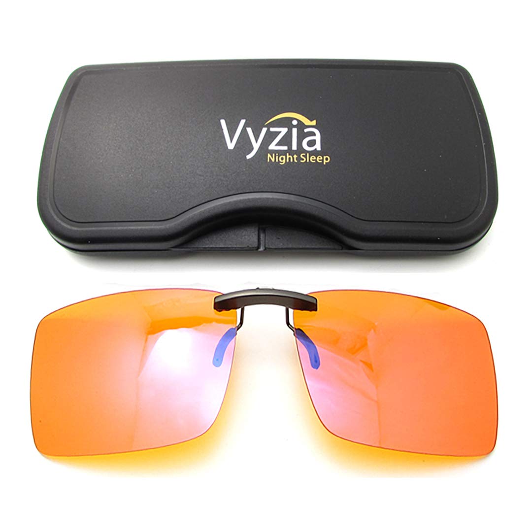 Vyzia Clip-On Blue Light Glasses worn over prescription lenses for seamless nighttime reading and reduced eye strain.