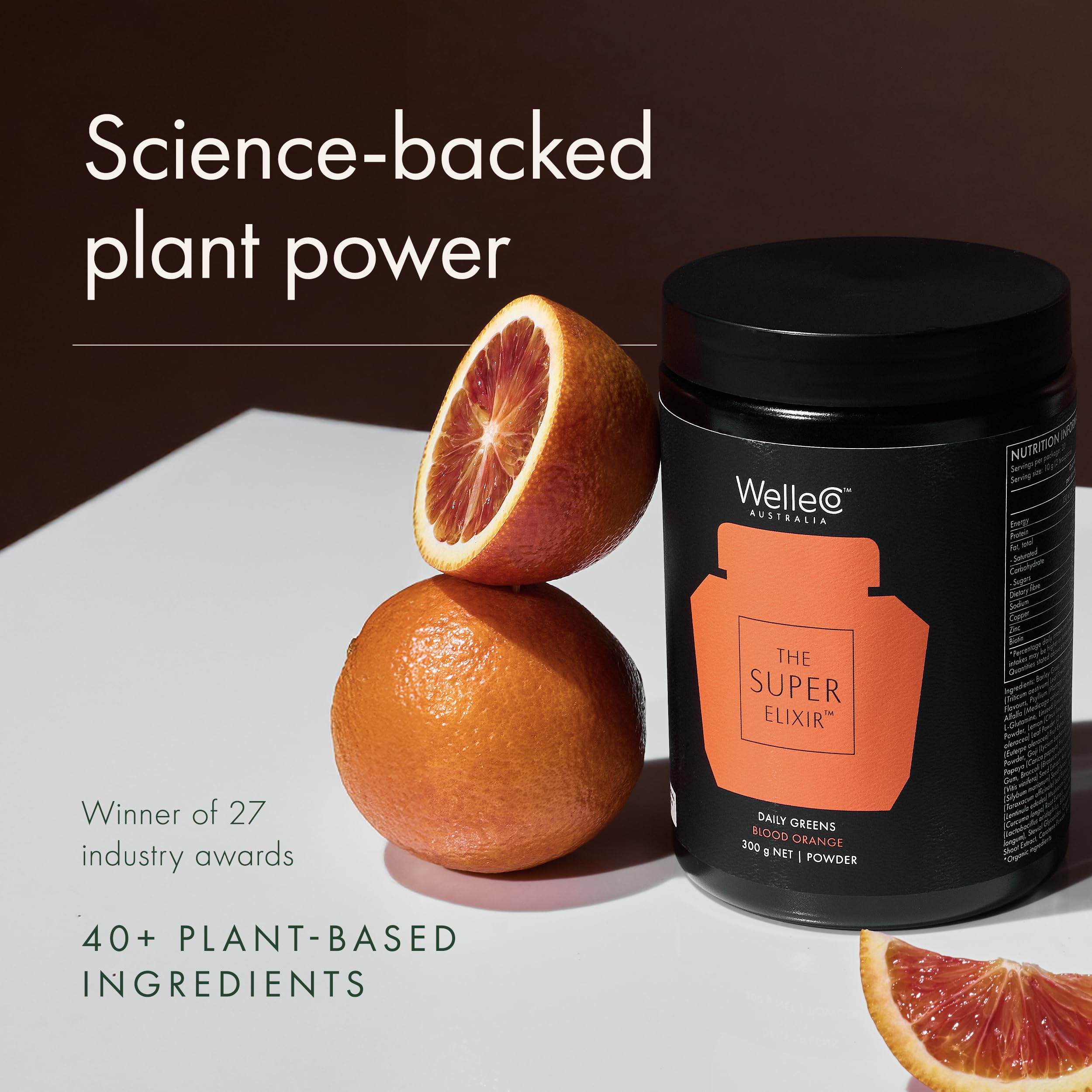 Scoop of WelleCo powder with glass, indicating convenient 10 g serving.