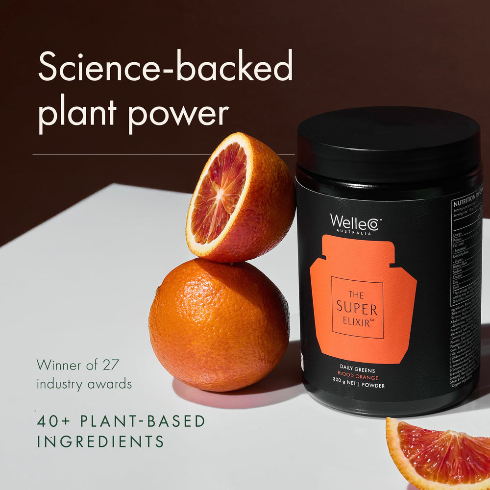 Scoop of WelleCo powder with glass, indicating convenient 10 g serving.