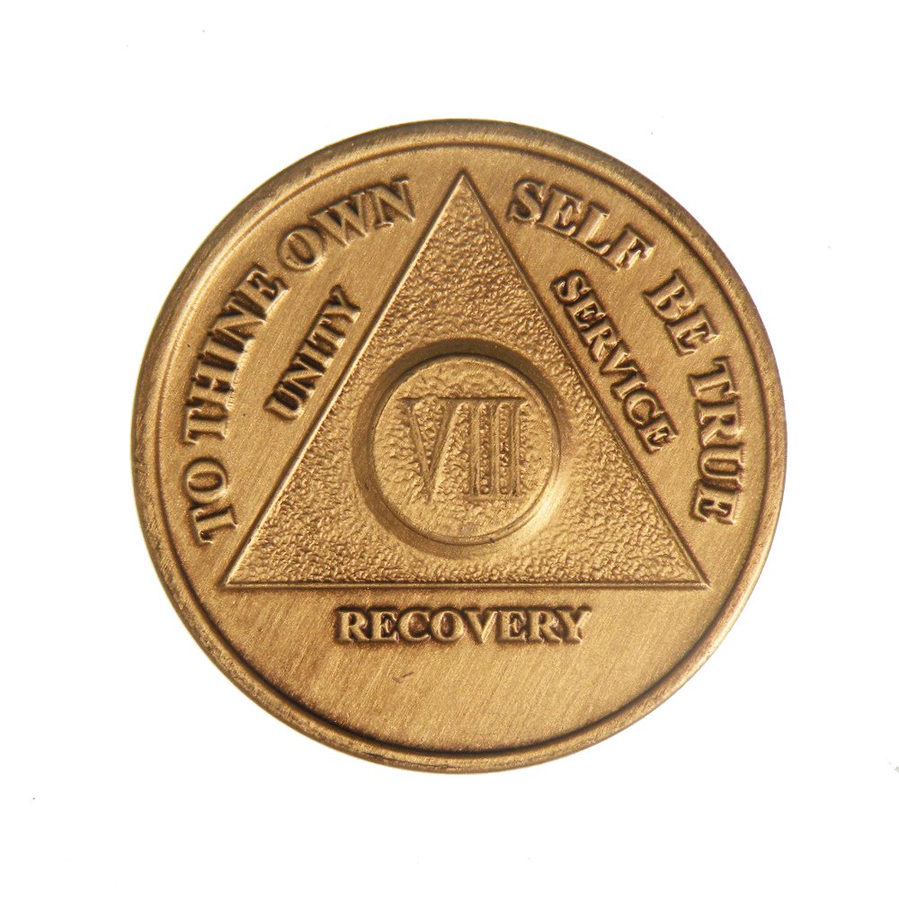Wendells 8-year AA bronze medallion—front view, a daily sobriety reminder.