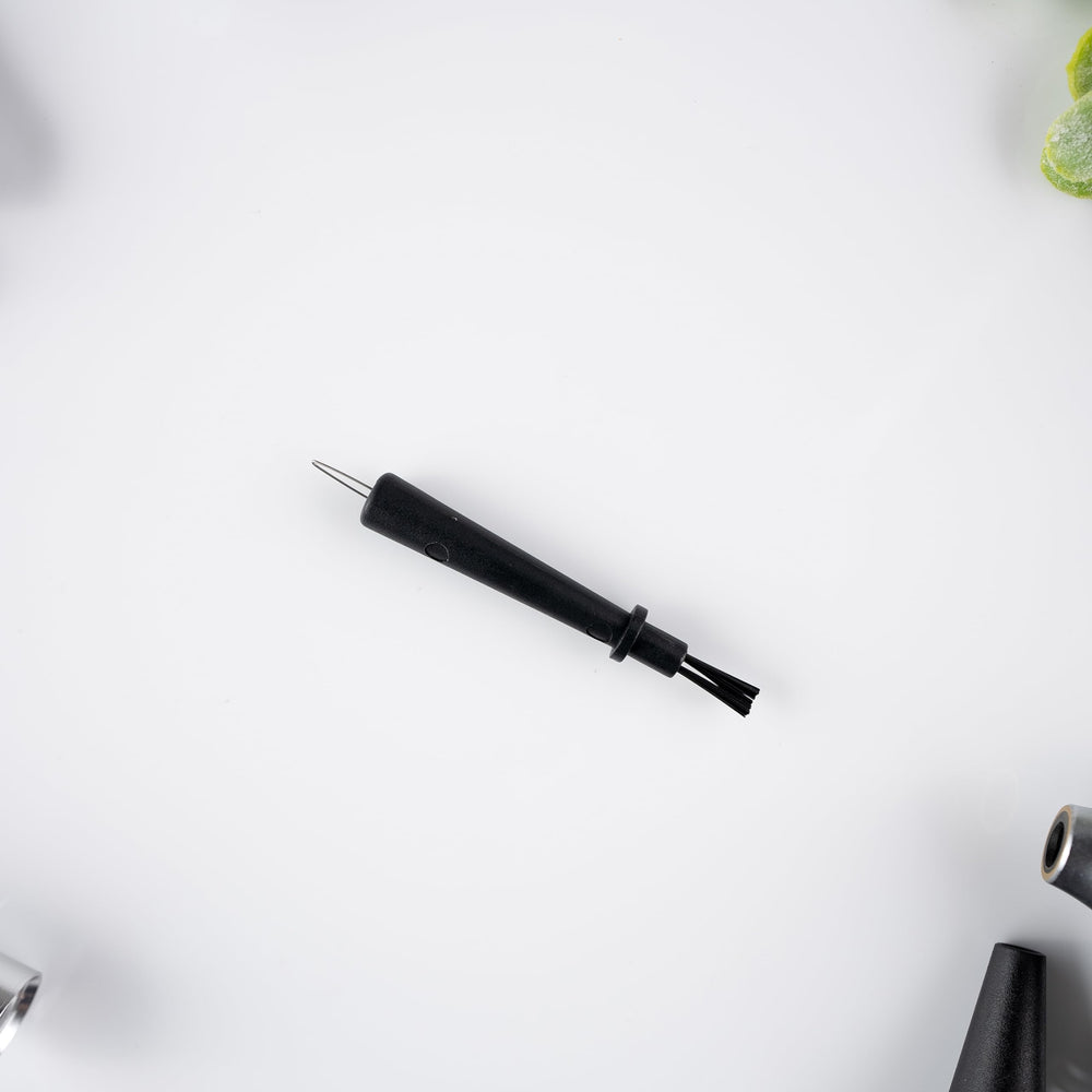 Westone Wax Loop travel case shown with compact tool for on-the-go maintenance.