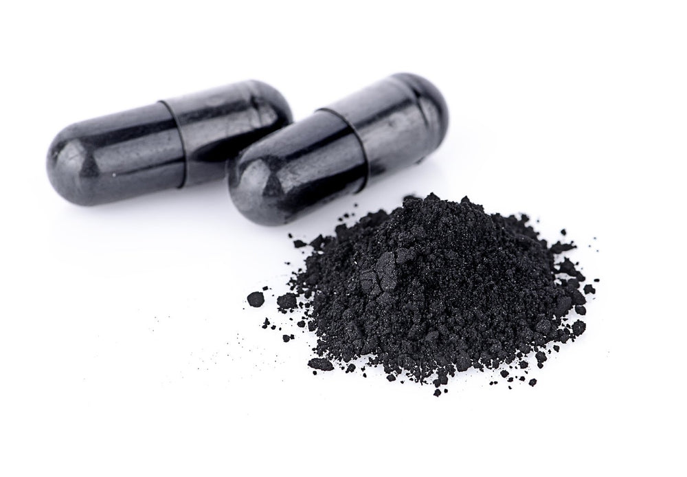 Travel-friendly Wild Foods charcoal bottle for on-the-go detox