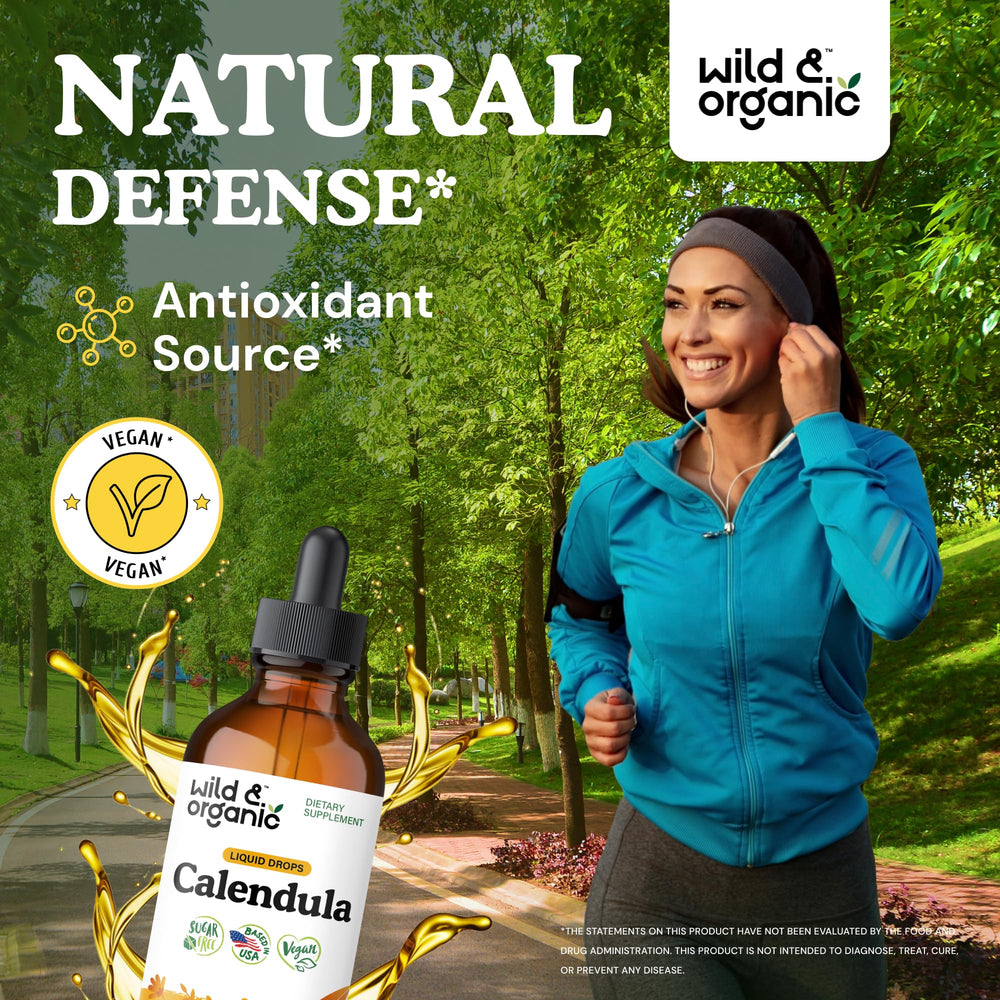 Wild and Organic calendula tincture dropper dispensing a dose for daily immune support.