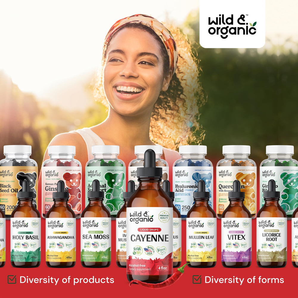Wild & Organic cayenne tincture glass bottle close-up showcasing vibrant red extract.
