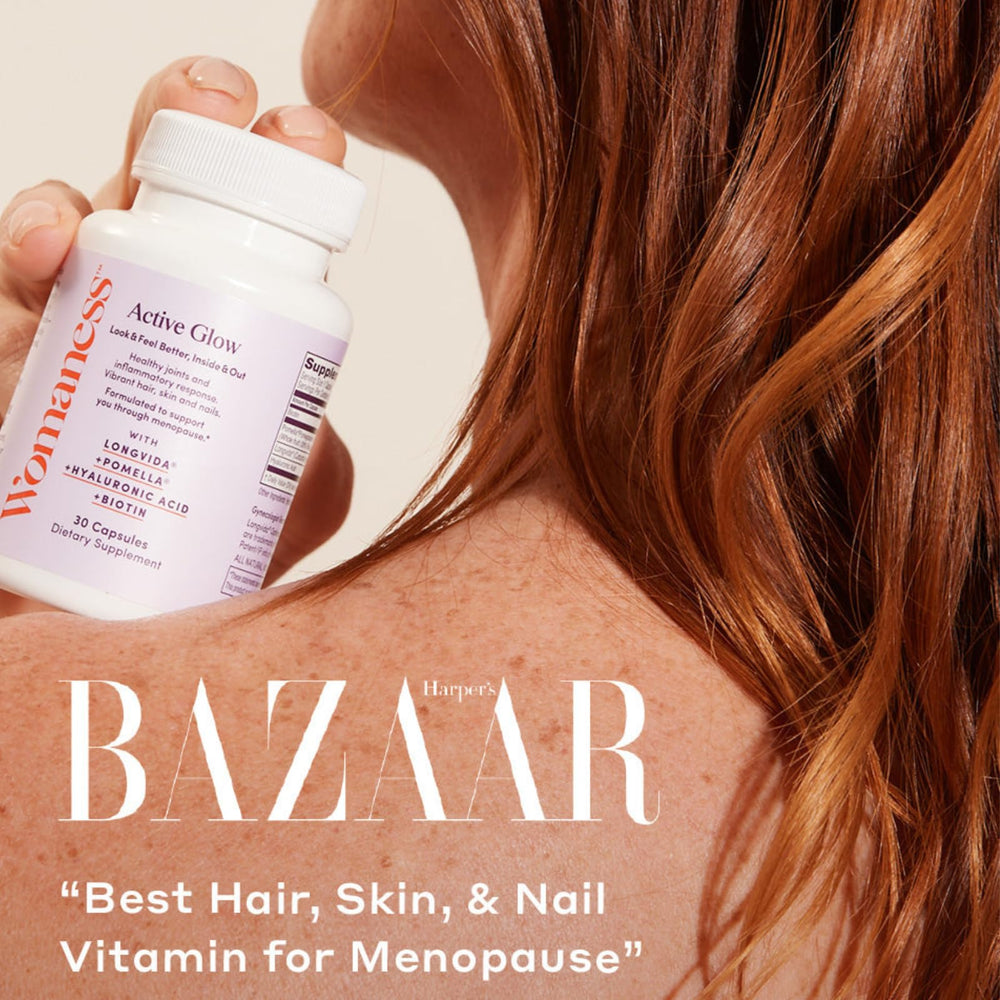 Hero shot of Womaness Active Glow beside a skincare routine setup.