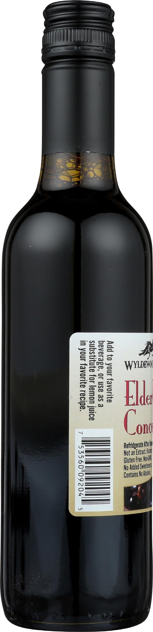 Glass of Wyldewood Cellars Elderberry Concentrate ready to mix into drinks.