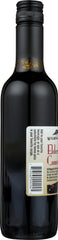Glass of Wyldewood Cellars Elderberry Concentrate ready to mix into drinks.