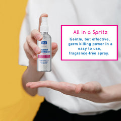 User applying X3 Clean hand sanitizer spray to hands without residue