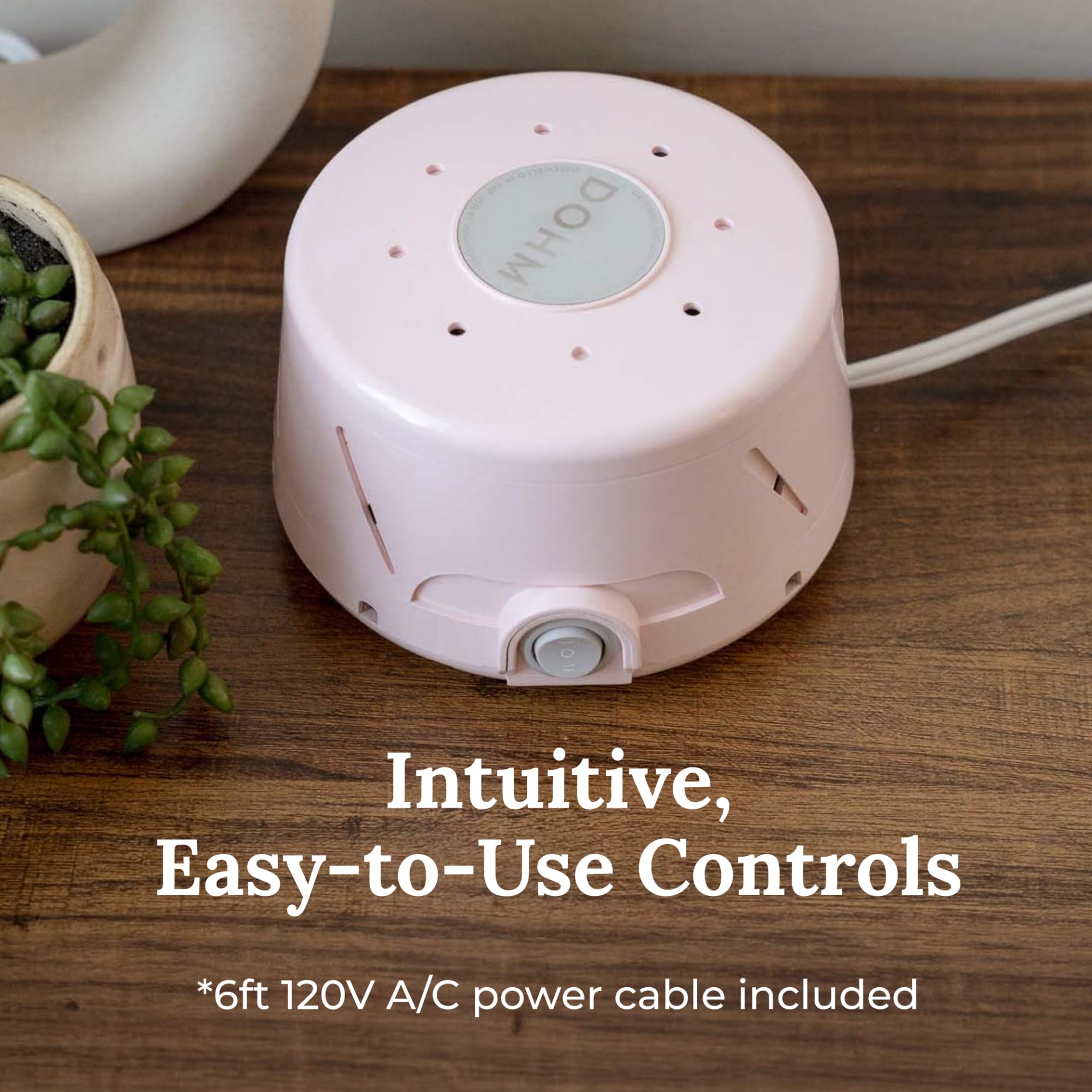Yogasleep Dohm Classic Pink in travel use for quiet hotel stays