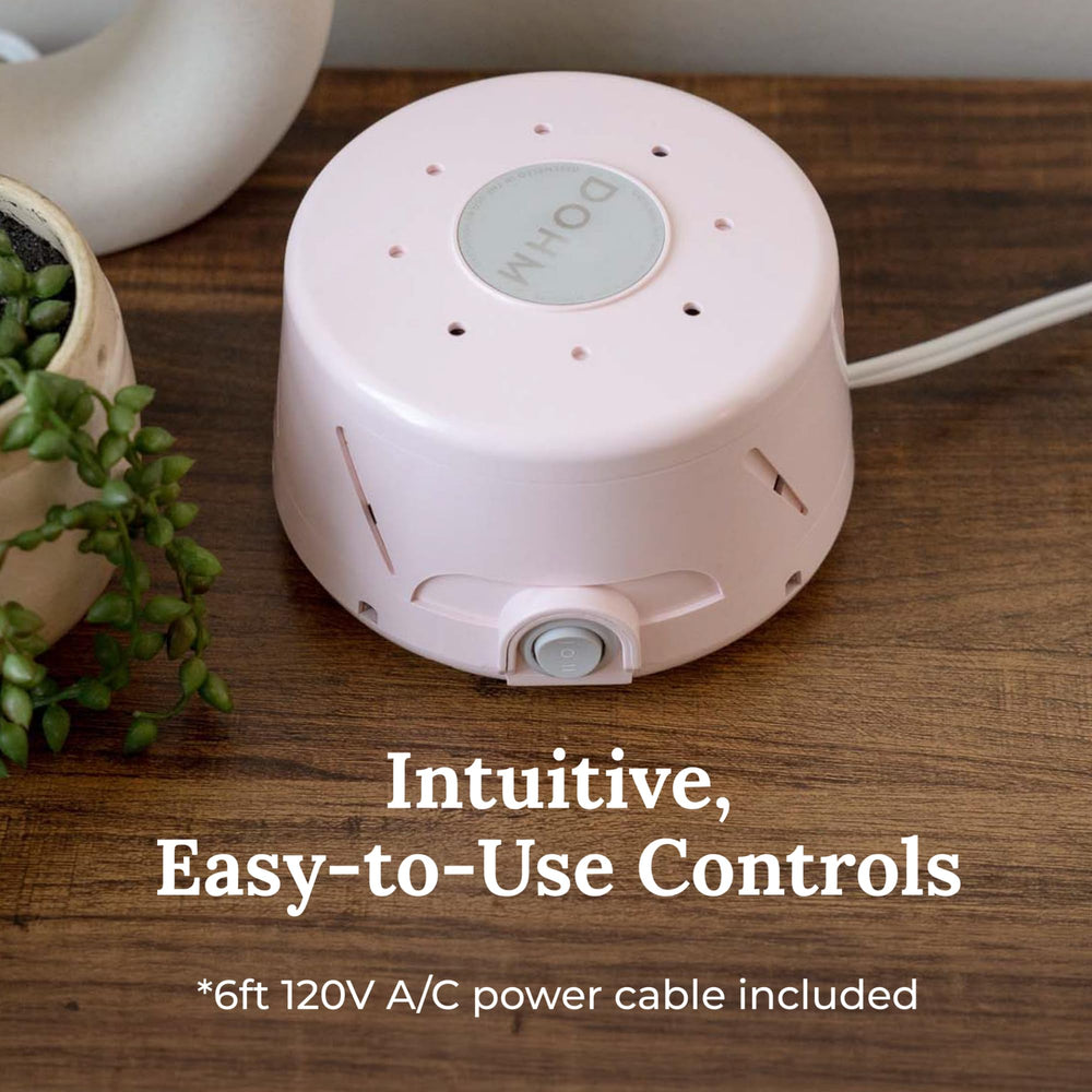 Yogasleep Dohm Classic Pink in travel use for quiet hotel stays