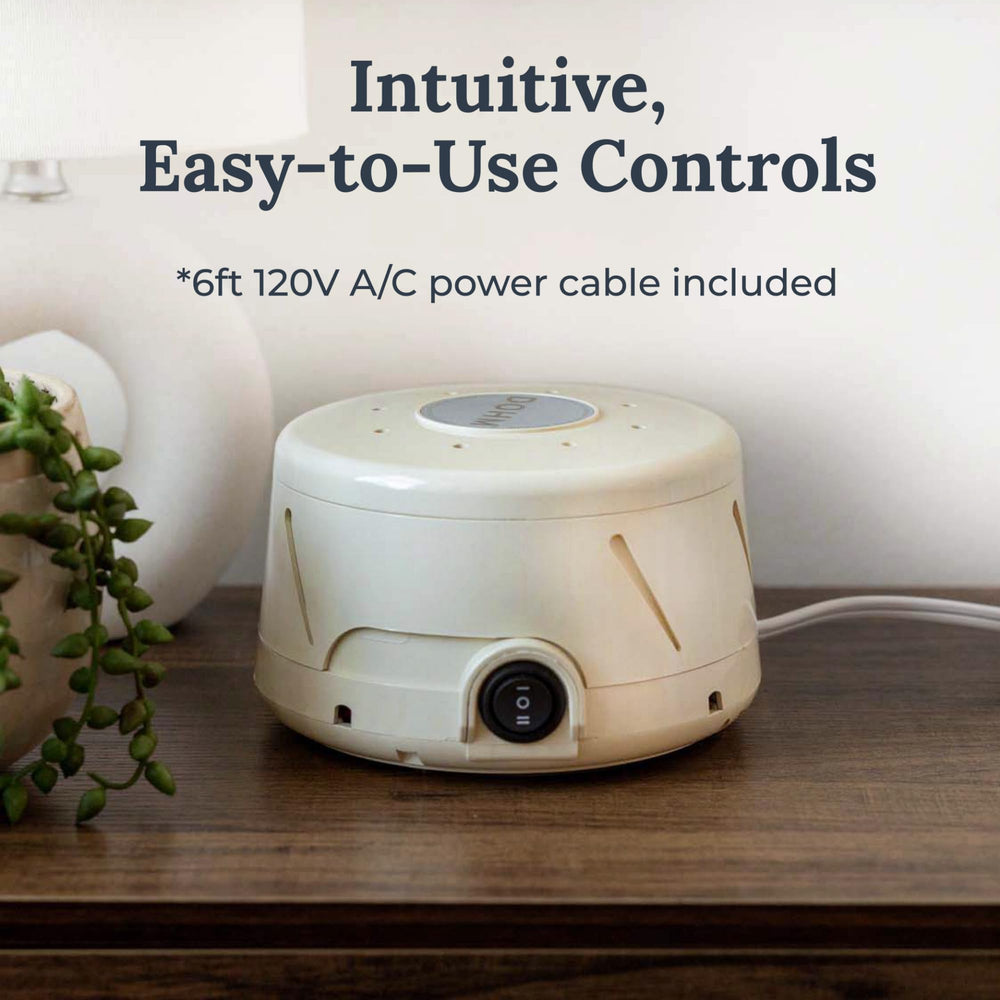 Yogasleep Dohm Classic Tan on an office desk for privacy and focus