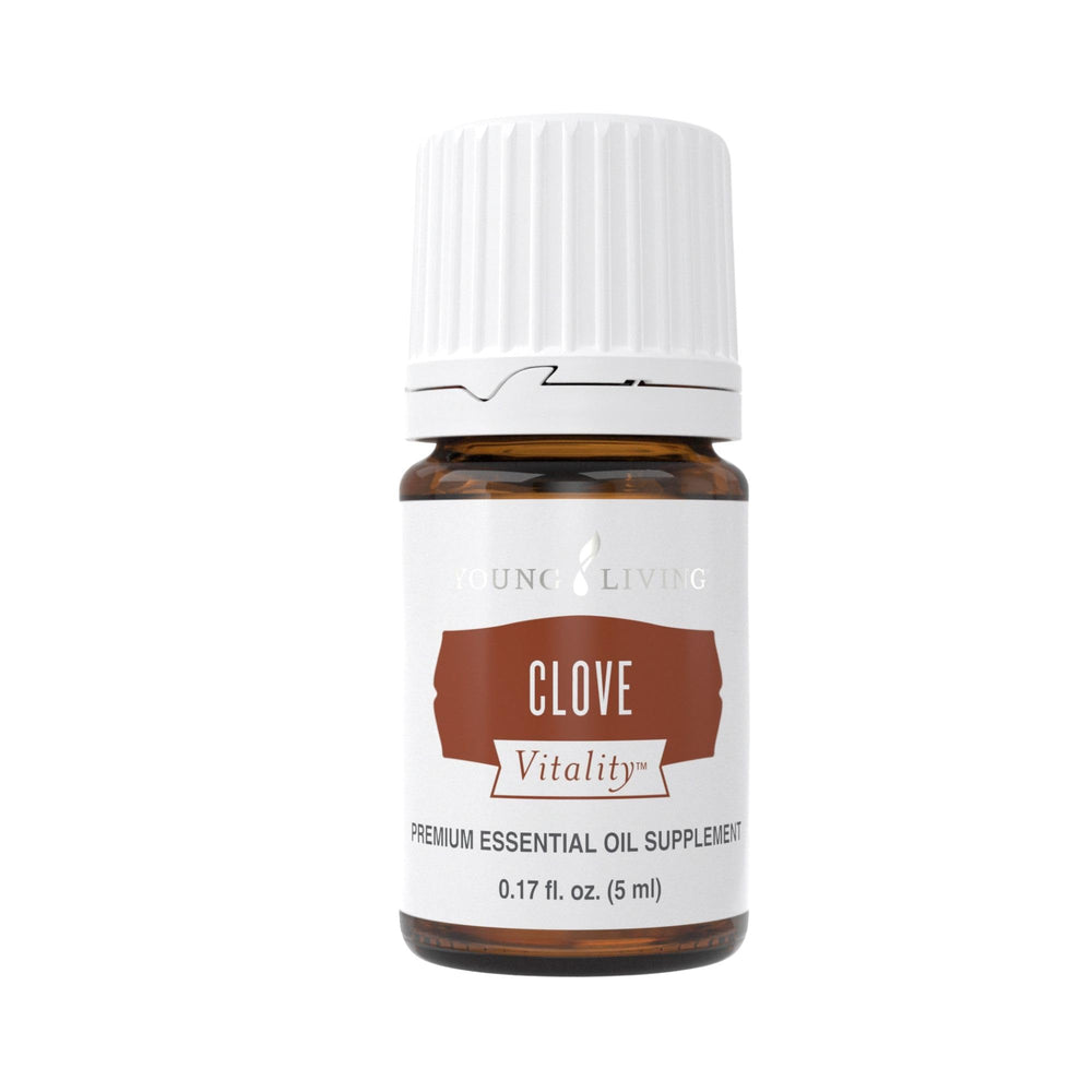 Young Living Clove Vitality bottle with dropper adds warm spice to tea.
