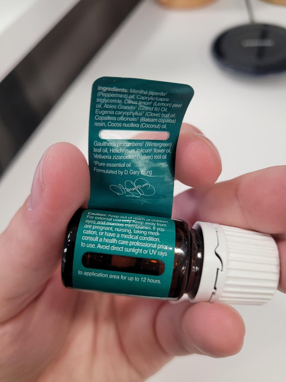 Young Living Deep Relief bottle pour showing easy post-workout application