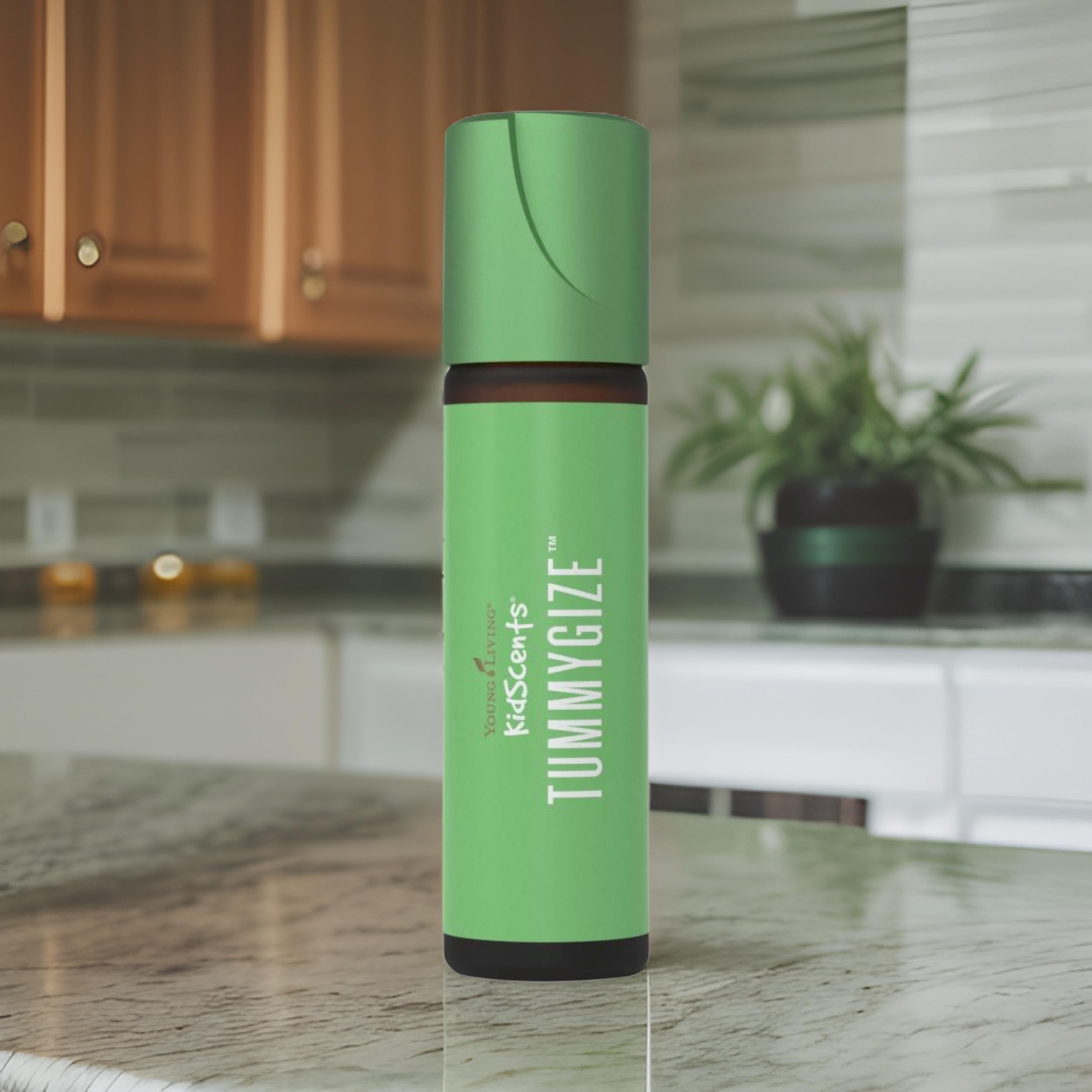TummyGize roll-on applied to abdomen for gentle, kid-friendly use.