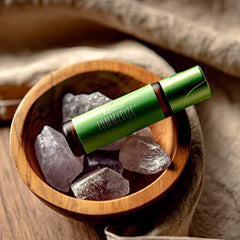 Young Living KidScents TummyGize bottle on skin with citrus-ginger aroma for calming routine.