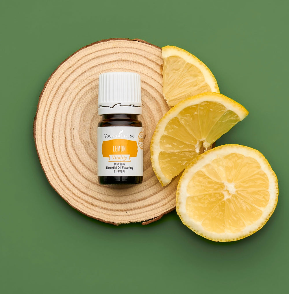 Lemon Vitality oil droplets on a lemon slice for bright flavor
