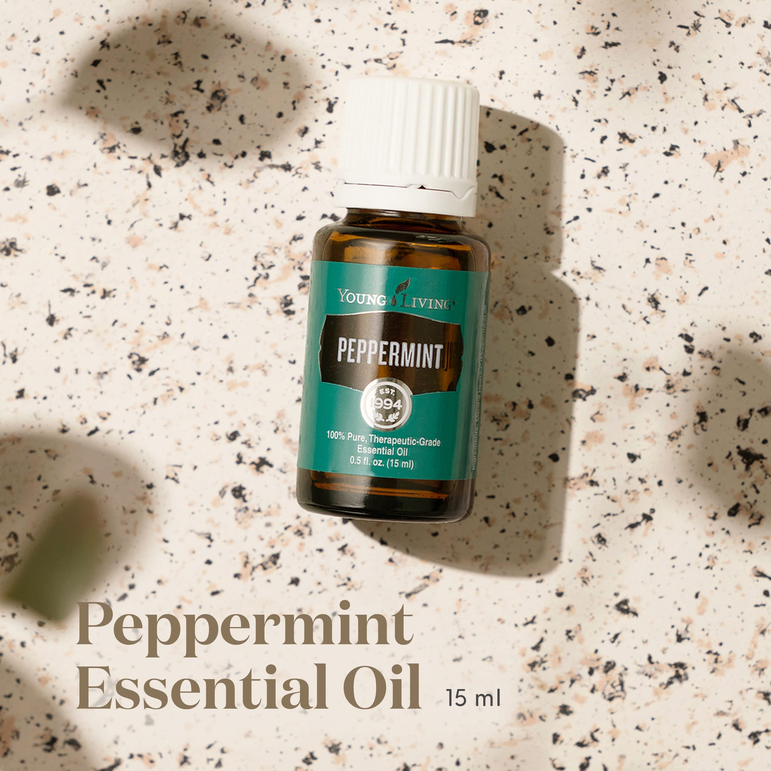 Young Living Peppermint Oil in diffuser setup for refreshing ambiance.