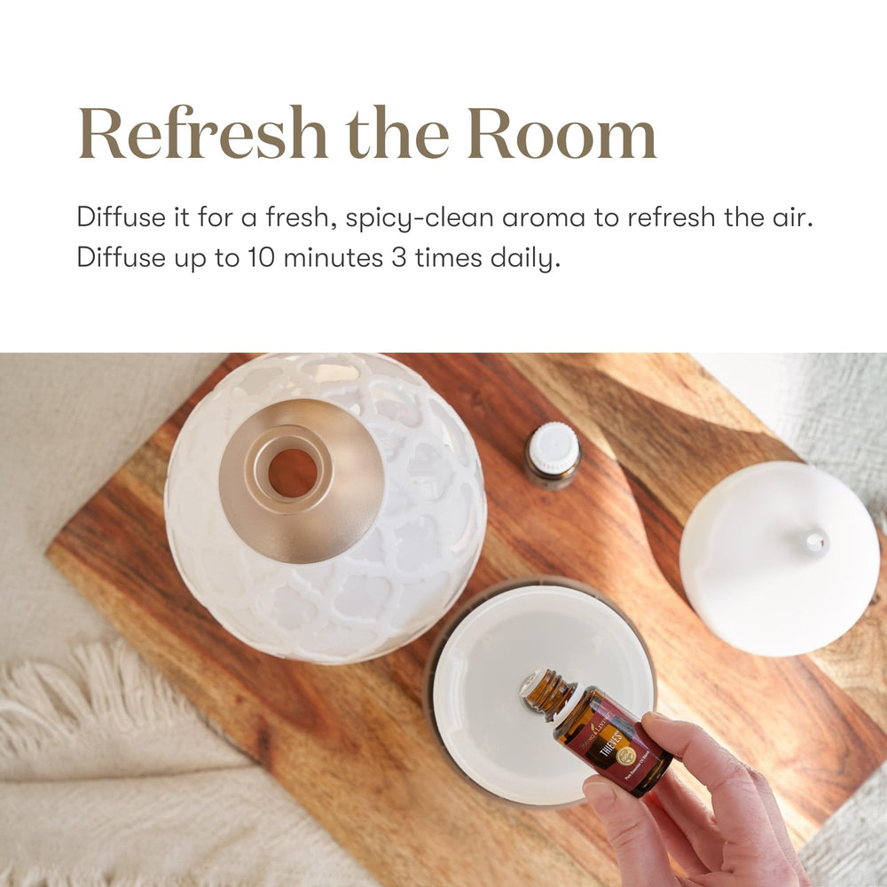 Young Living Thieves cleaning setup for fresh scents during tasks.