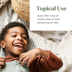 Young Living TummyGize in hand showing soothing aroma for little ones