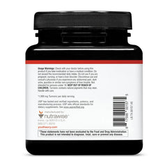 Youtheory Turmeric Extra Strength bottle resting on a shelf for display