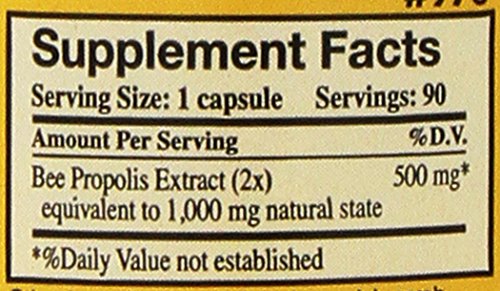Hands holding YS Organic Bee Farms Propolis Raw 1000mg capsules, convenient daily supplement