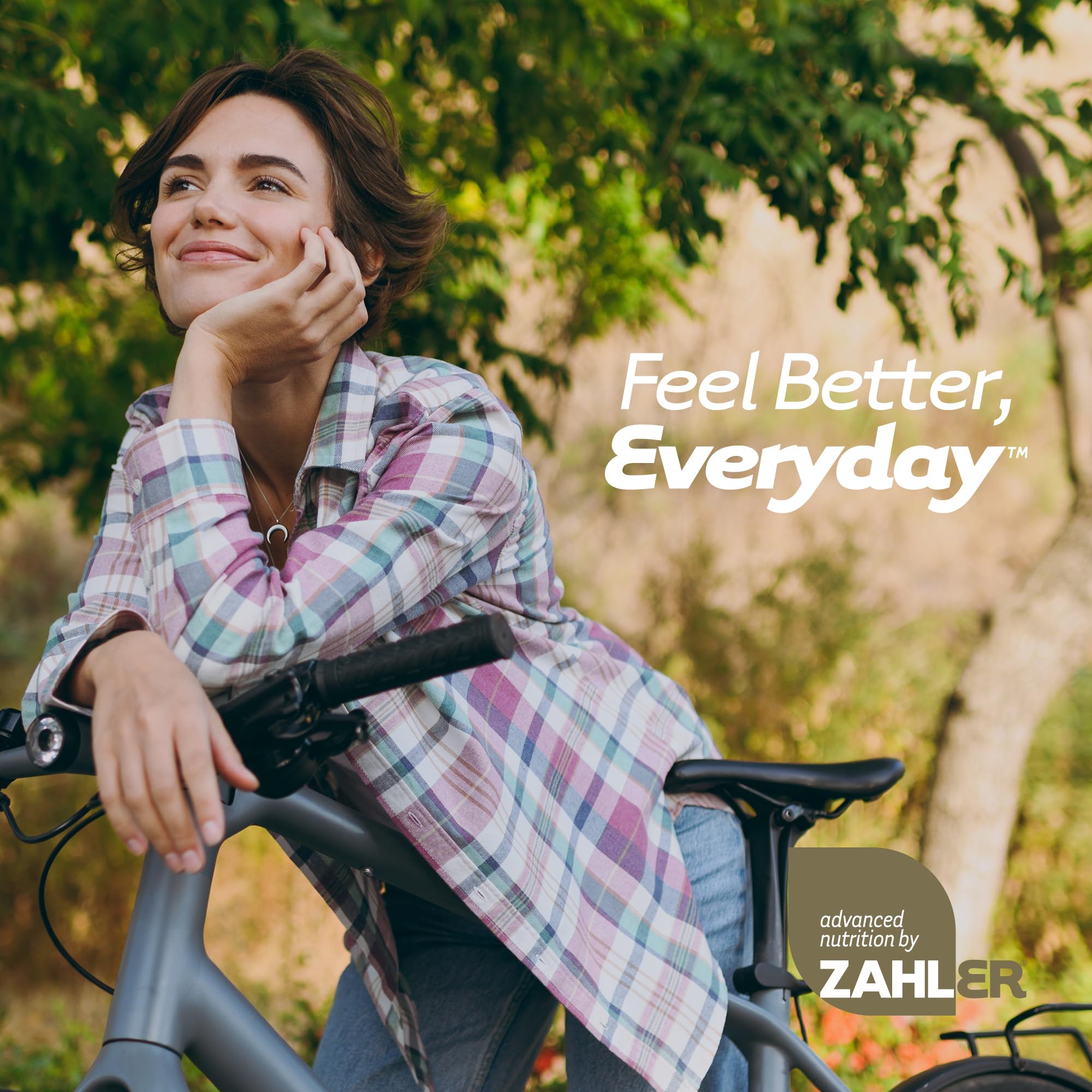 Zahler RevolUTion woman taking capsules with a glass of water.
