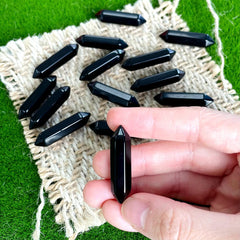 ZHIYUXI obsidian crystal wand closeup for calming rituals.