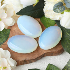 ZHIYUXI Opalite palm stone held in hand for stress relief